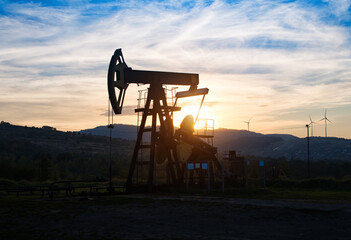 oil pump on sunset