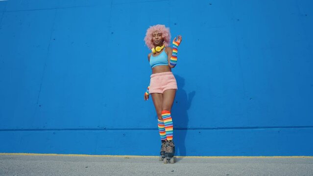 Beautiful woman skating with roller skates and having fun. Professional skater and dancer training in the morning