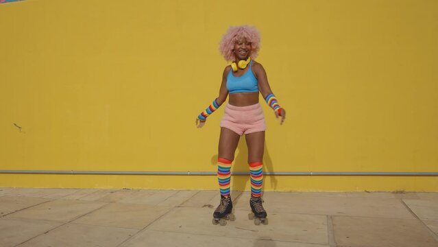 Beautiful woman skating with roller skates and having fun. Professional skater and dancer training in the morning