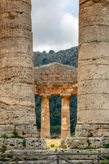 Fototapeta premium Calatafimi-Segesta, Sicily, Italy - July 9, 2020: Doric Temple and landscape of Segesta in Sicily, Italy