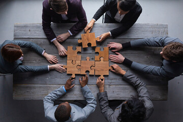 Business people team with puzzle