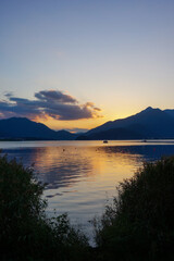 Naklejka na ściany i meble Beautiful lakeside and sky at sunset