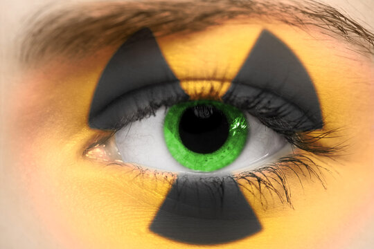 female eye with radioactive sign