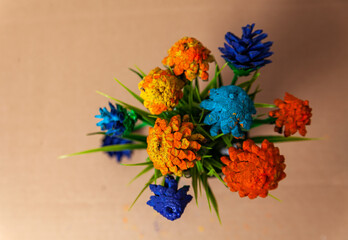  Flowers made of pine cones and artificial grass
