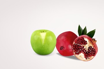 Fresh ripe red pomegranate and apples fruits