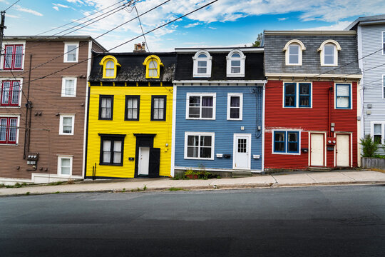 
St. John's Newfoundland Canada, September 24 2022: Colourful Jelly bean homes painted in different colours at a harbour city in Atlantic Canada.
