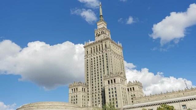 Time lapse, Stalin's Palace of Culture and Science on a sunny day on blue sky with clouds background. Warsaw