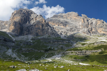 Fototapeta na wymiar Sunny summer landscape with monumental rocks in the Brenta Dolomites, Tialy