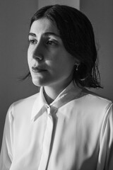 creative portrait of a young woman looking for an emotion of drama