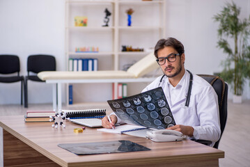 Fototapeta premium Young male doctor radiologist working in the clinic