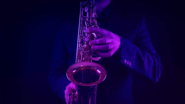 Saxophone Player At Concert In Colorful Lights