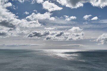 Endless sea view, bright sunlight and clouds