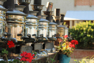 Tea urn semavers are ordered nicely at garden