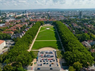 Bird's eye view of the Kasprowicz park of Szczecin in Poland under a cloudy blue sky - obrazy, fototapety, plakaty