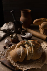 Sliced bread and ingredient at wood table. Homemade bread on wooden tabletop