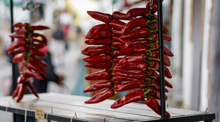 Three strings of AOP Espelette pepper in Espelette in the Basque Country. It is dryed red pepper.