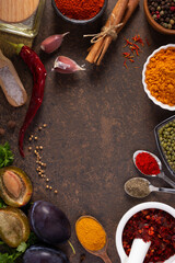Variety of spices and herbs at table background. Cooking concept and ingredients on table