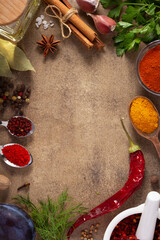 Variety of spices and herbs at table background. Cooking concept and ingredients on table