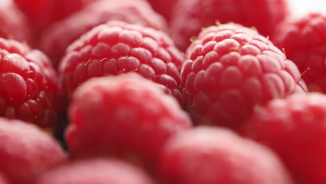 Fresh red raspberries close up rotating