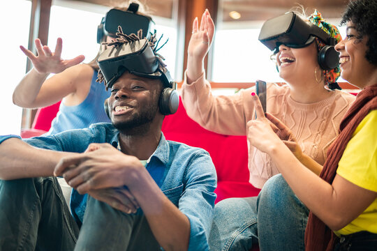 Group of young gamer testing a new wearable technology