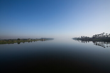 foggy sunrise over the Nile river 