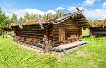 Ancient wooden residential house in Russia. X century settlement, typical houses reconstruction