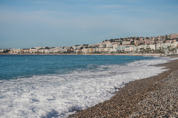 Morning view of Nice beaches and mediterranean sea with waves