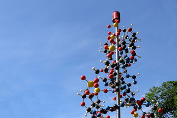 DNA-string with colorful balls. Spiral atom and molecules. 3D model. Outside in nature. Sweden,...