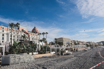 Fototapeta na wymiar Nice, France - 29.09.2022 : Dismantling of the private beach in front of the Negresco hotel in Nice, at the end of the season