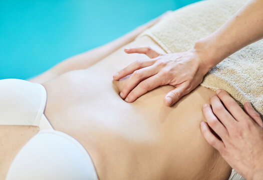 Osteopath Performing A Pelvic Floor Recovery Massage On A Patient