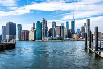 Fototapeta na wymiar Lower Manhattan skyline with One World Trade Center facing East River seen from the Pier 1 in Dumbo, Brooklyn, New York City, USA