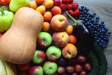 Various healthy fresh fruit and vegetable on wooden table. Top view.