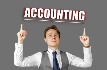 Businessman points fingers at the inscription - ACCOUNTING