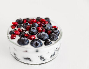 blueberries, pomegranate seeds and yogurt