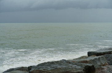 Bad weather at sea, clouds, coast and impending storm