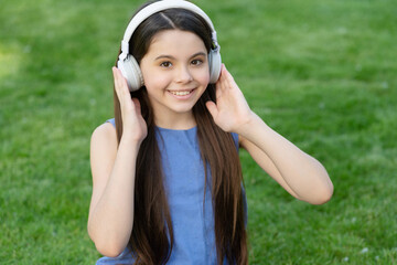 happy teen girl listen music. child in wireless music headphones. kid listening to music