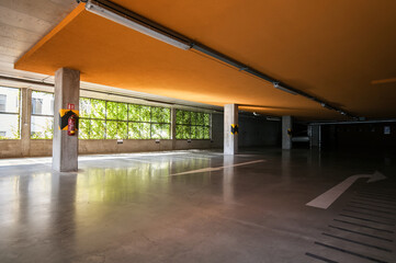 Empty parking spaces in the underground garage of a new building.