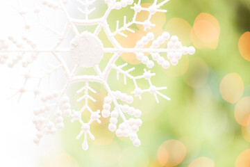 Snowflake Over an Abstract Green and Gold Background