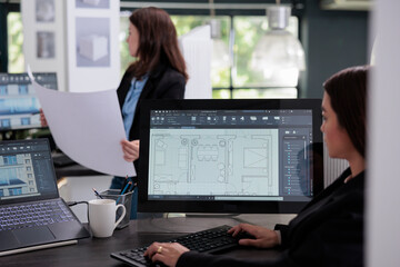 Real estate agent prototyping in room floor planner software, using design 2d creator app,...
