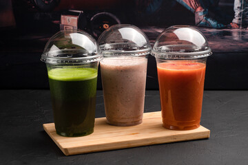 Smoothies, smoothies with different flavors on a black background