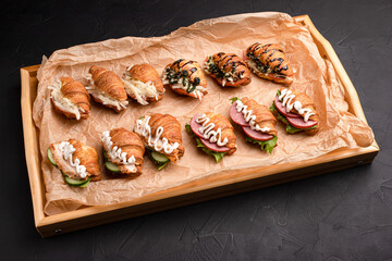 Croissants with fillings, croissants with different fillings on a black background