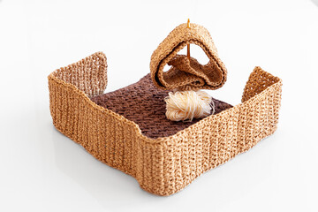 Crocheted handmade work in progress, baskets crochet pattern.