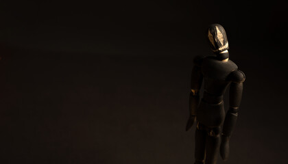 doll with a devilish smile, on a black background, halloween
