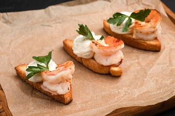 Bruschetta, different bruschetta with different fillings on a black background
