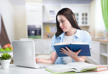 Smiling student woman study with books at home