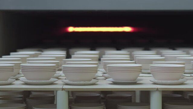 Porcelain workshop: ceramic plates in the kiln.