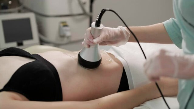 Body RF lifting procedure. Woman getting anti-cellulite and anti-fat therapy