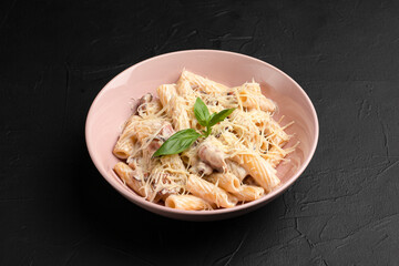 Carbonara, carbonara pasta with cheese on a black background