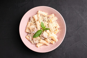 Carbonara, carbonara pasta with cheese on a black background