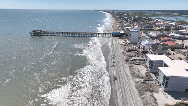 Damage to vacation homes, property and beach erosion from Hurricane Ian storm surge in Surfside Garden along South Carolina coastline 